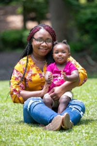 Terri with her daughter sitting on her lap. 