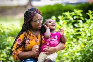 Terri and her daughter laughing outside. 