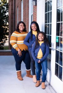 Camille with her two daughters, Keziah and Nema.