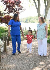 NFP nurse Dawn (left), NFP mom Jennifer (right) and Jennifer’s daughter, Charlotte (middle)