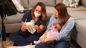 Debbie reading to Annabelle