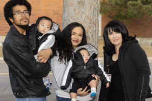 NFP mom, Sunn, and her finance, Faapepele, pose with their twins, Tomasi and Rusall and NFP nurse, Alina, in Salt Lake County, Utah.