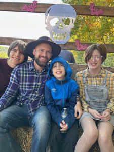 Nurse Adam with his three children.